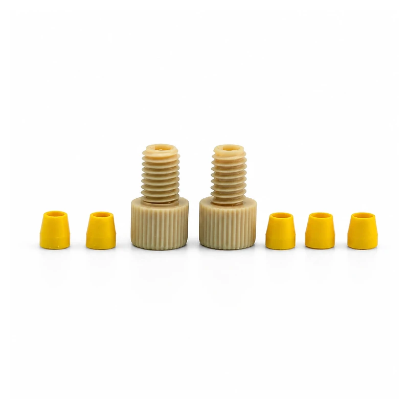 Two RZ03B PEEK fitting bodies with yellow ferrules